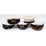 Four Royal Navy Officers' peaked caps and a Class II sailor's hat: (5)
