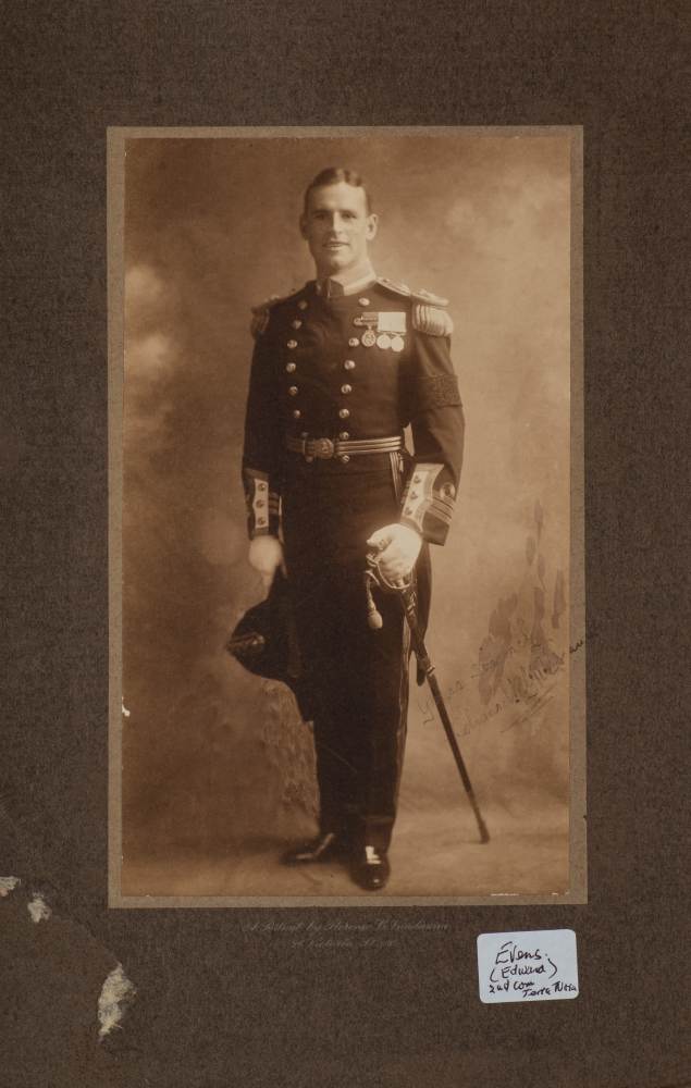 A signed full length photograph portrait of Expedition member Edward Evans in Royal Navy Uniform by