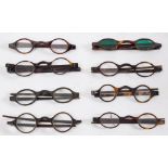 Eight pairs of 19th century tortoiseshell framed spectacles: including one pair with green tinted