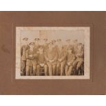 A card mounted sepia photograph of F E Davies and a group of unidentified RN officers: F E Davies