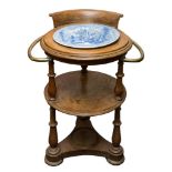 A late 19th/early 20th century circular oak cabin washstand: the smoker's bow style back with two