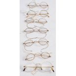 A pair of 9ct gold spectacles: together with six pairs of gold plated spectacles.