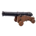 A cast iron desk cannon:,