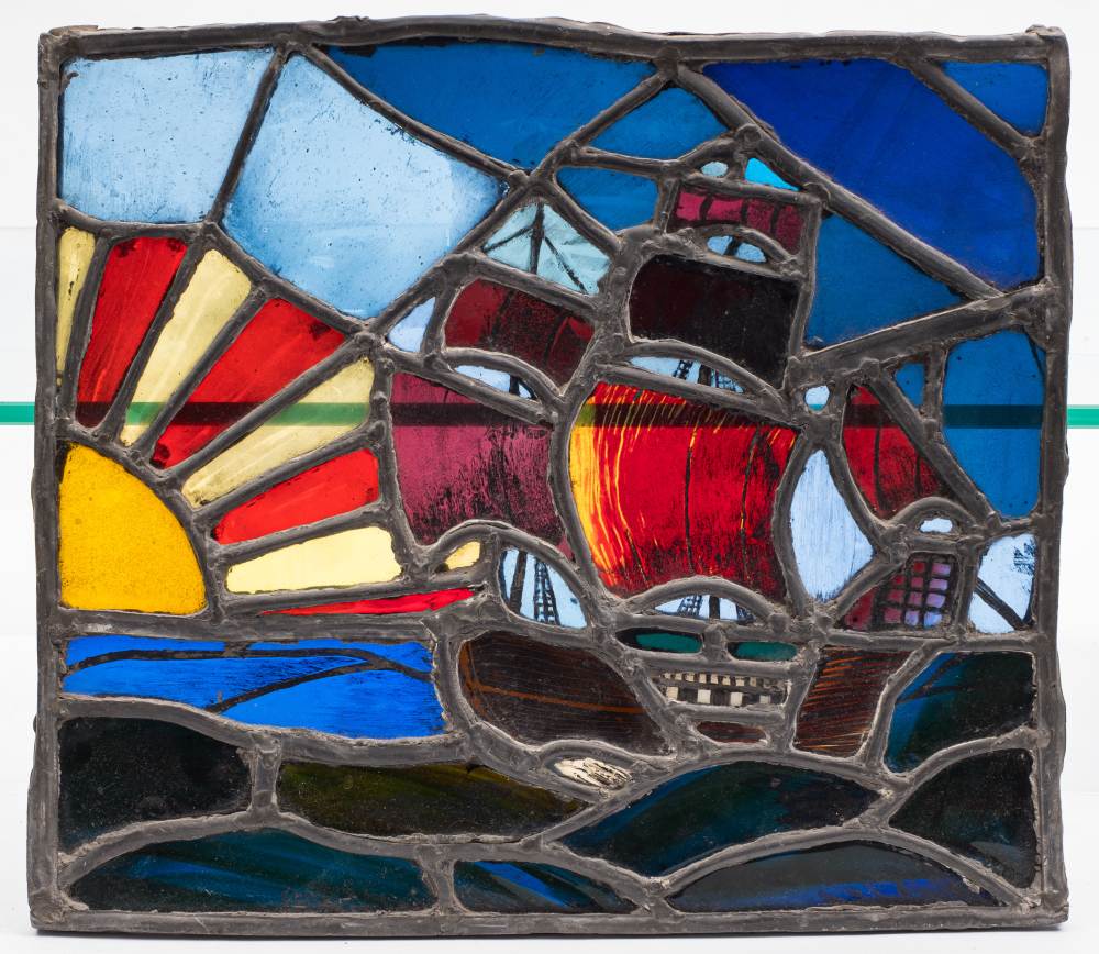 An early 20th century stained glass and leaded panel of a galleon: 36 x 41.5cm.