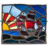 An early 20th century stained glass and leaded panel of a galleon: 36 x 41.5cm.