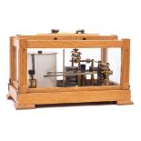 An oak cased combination barograph and thermograph: by On , serial number 5175,