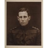 A framed half-length photogravure portrait of Captain L E G Oates after the original by G Lekegain