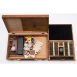 Two optician's small cased test sets: together with a leather cased opticians test set: comprising