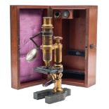 An early 20th century French brass compound microscope by E Hartnack & A Prasmowski,