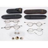 Four pairs of steel framed spectacles: including a pair in a gilt decorated mache case,
