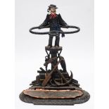 A cast iron maritime theme umbrella stand:,