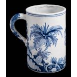 A Delft tankard in 18th Century style with armorial between palm tree style foliage: 14cm high