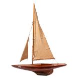 An early 20th Century style pond yacht:, the fully rigged sails over single piece laminated deck,