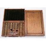An optician's cased test set in a stained beech case:,