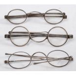 Three pairs of 19th century silver spectacles:, the pair London 1826,