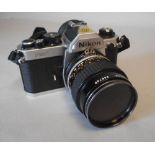 A Nikon FM2 35mm SLR camera: fitted with a Nikkor 55mm 1:2.8 lens, No 368700.