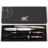 A Mont Blanc fountain pen and biro set: in black with gold bands,