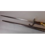 A French 1874 pattern Gras bayonet: the 52cm T-shaped blade inscribed Mre d'Armes de St.