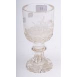 A 19th century cut glass goblet with hunting scene decoration: on a faceted knopped stem, 18.