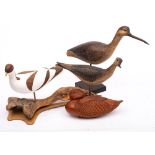 A group of four carved and painted wooden game birds: comprising a half block model of a duck,