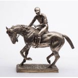 A large plated spelter figure of a race horse with jockey up: on a rectangular plinth base,