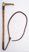 A George V silver mounted riding whip: with antler handle and silver ferrule, London 1932.
