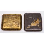 A Komai style iron cigarette case: inlaid with gold and silver depicting a temple before mount Fuji,