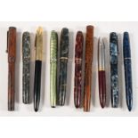 A group of ten vintage fountain pens: including a Blackbird Self- filling pen by Mabie,