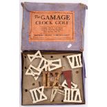 'The Gamage Clock Golf Game' in original box: together with four iron and one brass headed putters