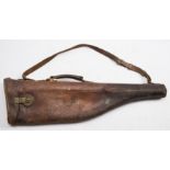 An early 20th century leather leg o' mutton gun case: initialed HAB' together with a leather gun