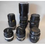 A collection of six Nikon camera lenses: including;- Nikkor 300mm 1:4.
