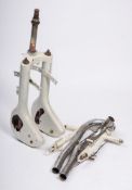 A set of vintage motorcycle front forks and rear swing arm,
