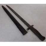 A 1907 bayonet for Lanchester, S M G: with 43cm fullered blade, wood slab grips, marked W S C S294,