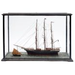 A late 19th/early 20th century cased scale waterline model of the clipper Pretty Polly: standing