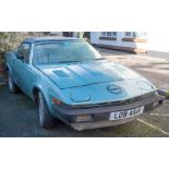 A 1981 Triumph TR7 convertible: registration 'LOB 451X', blue with black roof,