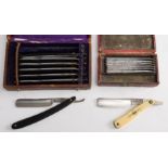 An early 20th century cased set of razors: each blade marked with a different day of the week,