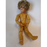 An Armand Marseille bisque head doll: impressed Armand Marseille. 390n. D.R.G.M.246/7. A. 1/2 M.