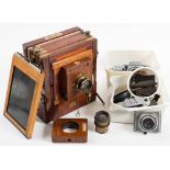 A mahogany and brass half plate camera by W.