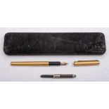 A Dunhill gilt metal fountain pen: with 14k gold nip and machine finish