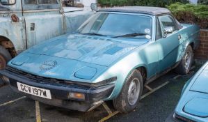 A 1980 Triumph TR7 convertible: registration 'GCV 197W' blue with black roof ,