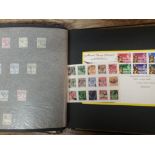 A collection Of Malaya and India stamps in an album: