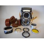 A Rolliflex 2.8F twin lens camera serial No 2415302: with diffuser, the upper lens Heidosmat 1:2.