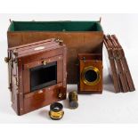 A mahogany and brass three quarter plate camera by W Waston & Son, London,