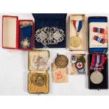 A WWII War Medal together with a collection of enamel badges etc.