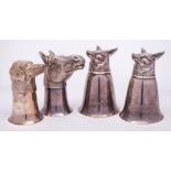 A set of four Continental silver plated stirrup cups: two with fox head decoration,