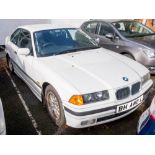 A 1998 BMW 323i automatic: registration 'R751 JAF', white with black cloth interior and sunroof,