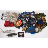 A collection of various cap and shoulder badges: various regiments also a WWII Civil Defence 'Fire'