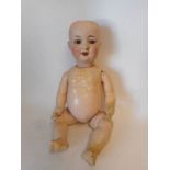 An Armand Marseille bisque head doll: impressed 560a. A.4 M.D.R.G.M.