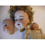 A damaged Armand Marseille bisque head doll: impressed A.M. 11 DEP.