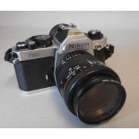 A Nikon FM2 35mm SLR camera: fitted with a Nikon AF Nikkor 35-70mm 1:3.3-4.5 lens.